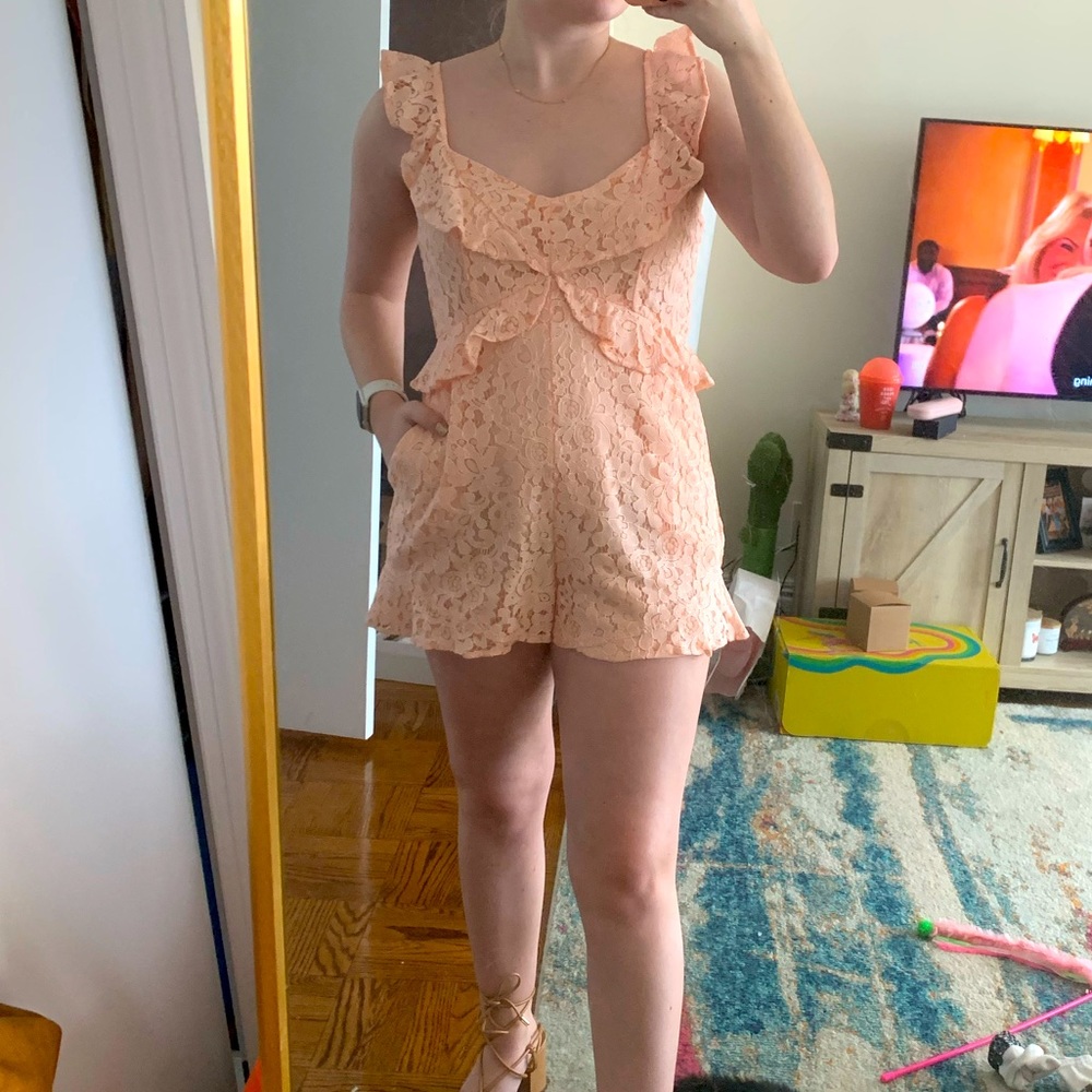Pink lace romper with pockets